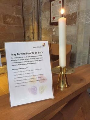 Candle in Ripon Cathedral burning to remember those in Paris