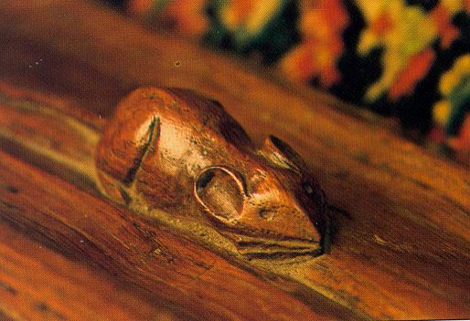 Mouse carved into wooden furniture