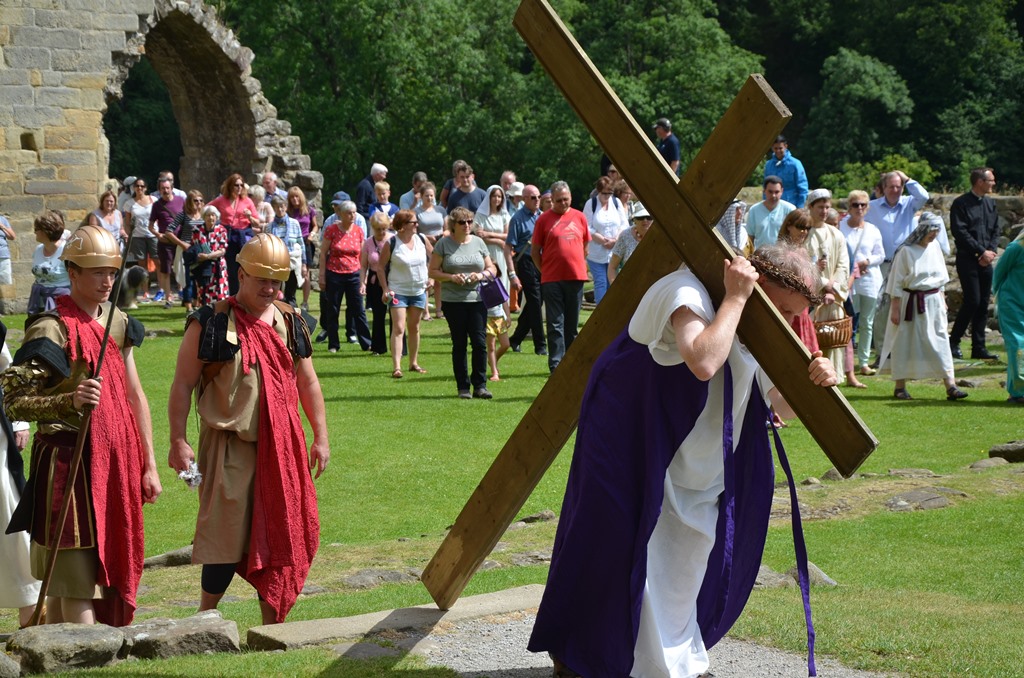 Jesus carries his cross