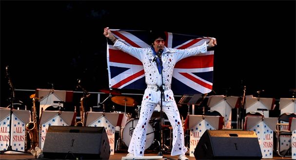 Revd Kelso as Elvis on stage in Pershore Park on Jubilee Monday