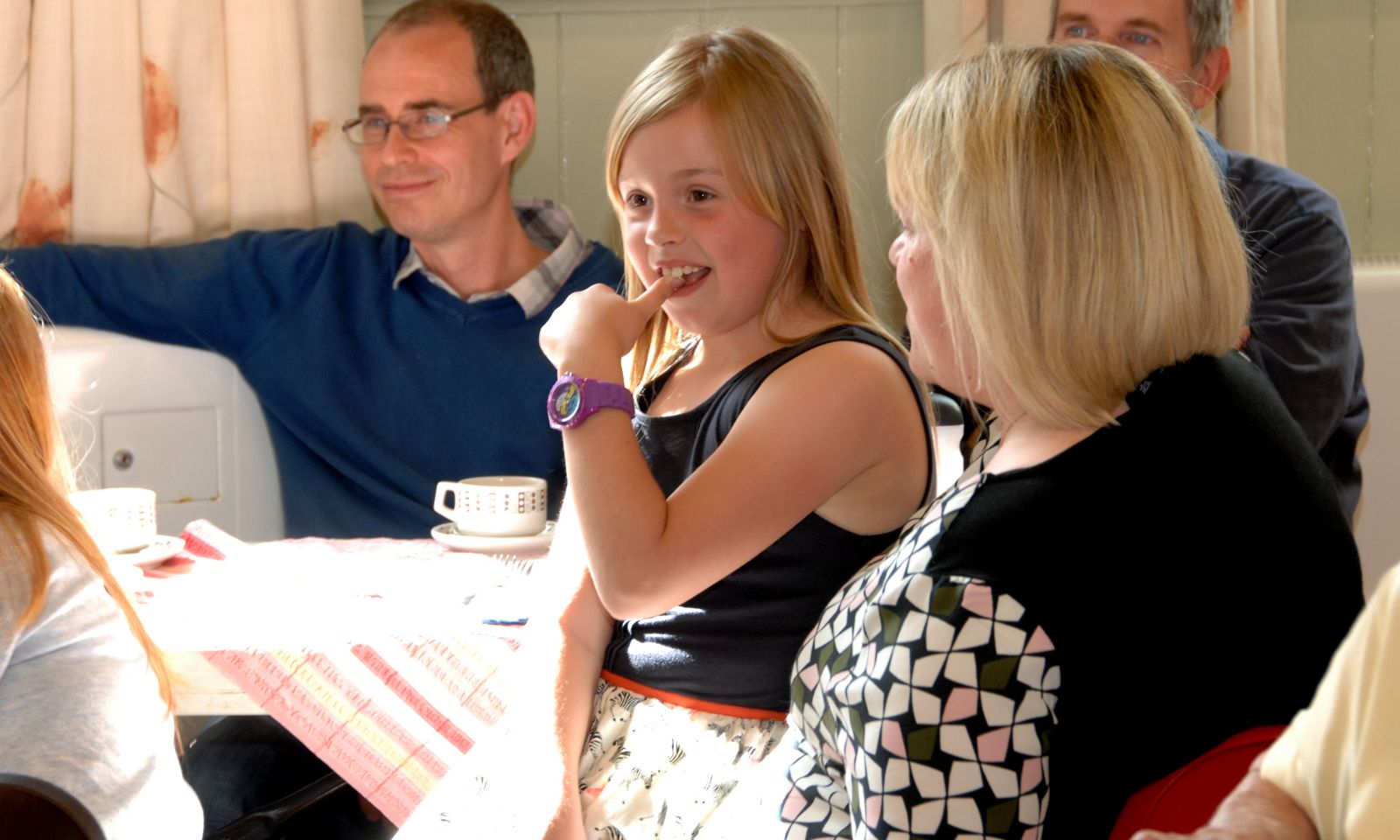 Young girl enjoying cake at the Heavenly Bake Off