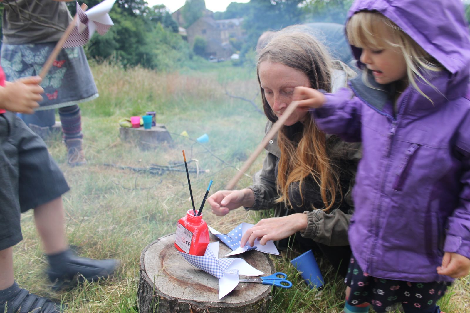 Young children and parents enjoying the crafts at Get Up and Grow