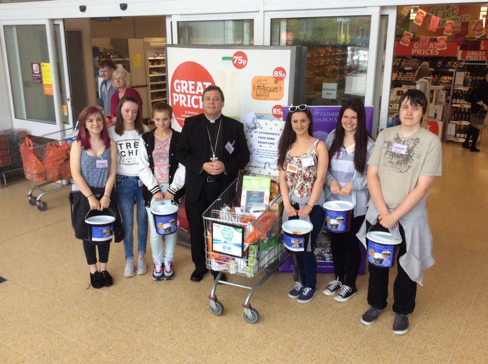 The Rt Revd Tony Robinson with those taking part in the NCS programme in Sainsbury's