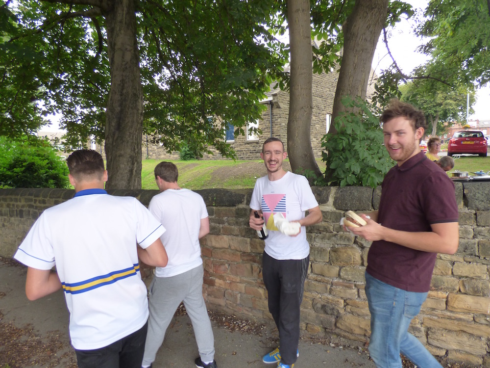 Hungry football fans with their burgers before Saturday's football game