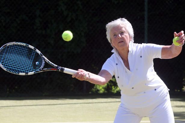 Mary Durrans playing a game of tennis