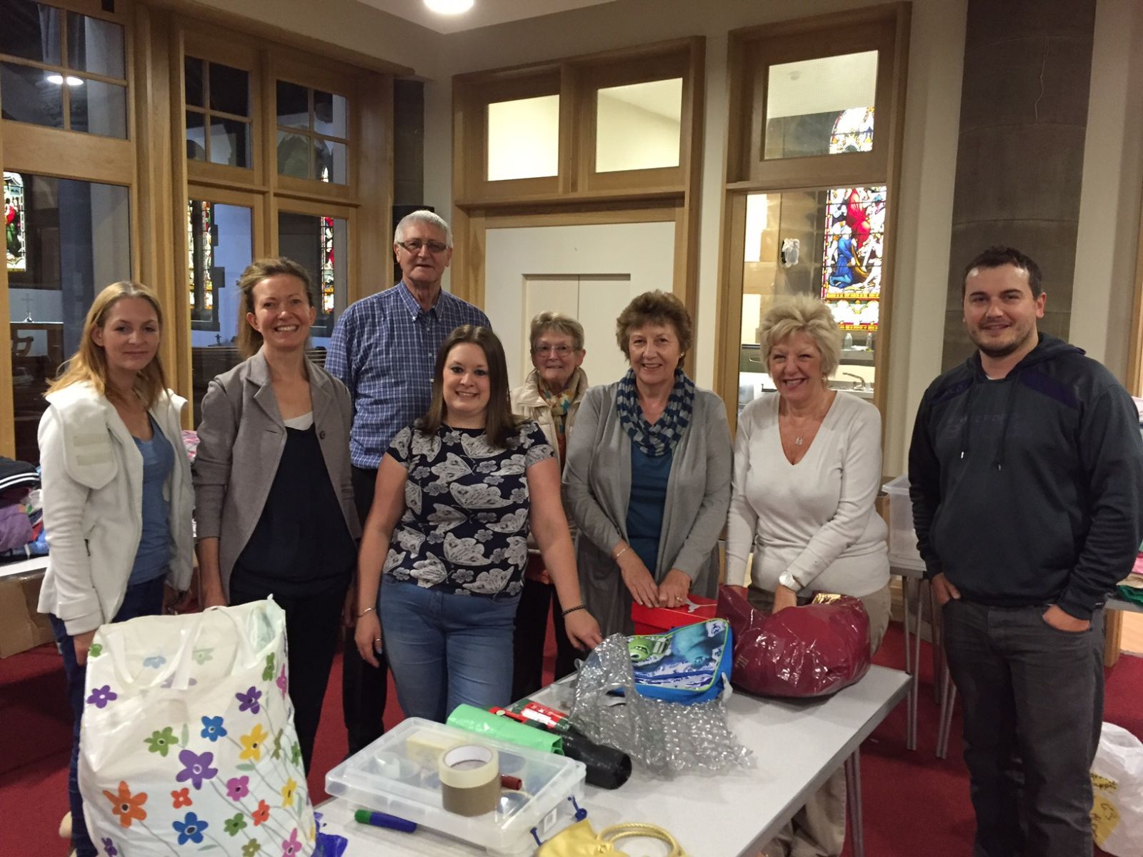 Rebecca Fitzsimons, Juliette Evans, Roy Isherwood, Margaret Couch, Elaine Robinson, Ann Penfield, Dan Hoyle starting to sort donations at St John's Church, Cleckheaton