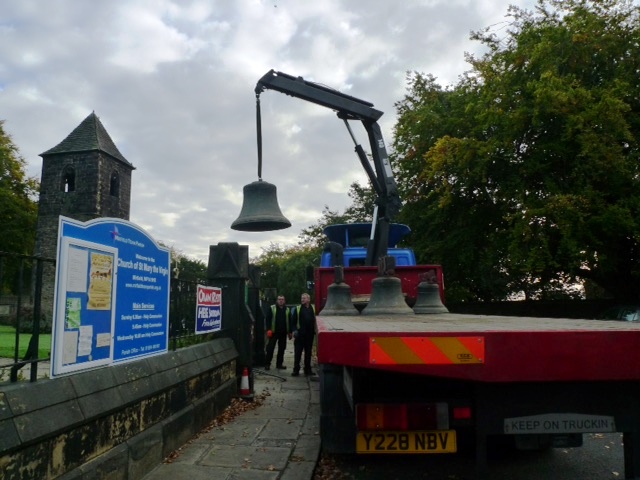 One of the bells being lifted onto the lorrey