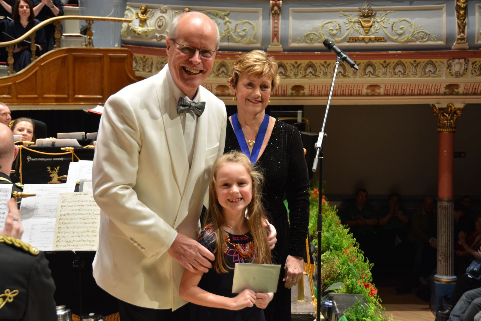 Eve Antoniades being presented with her prize by Brian Kay and Jane Sargent.