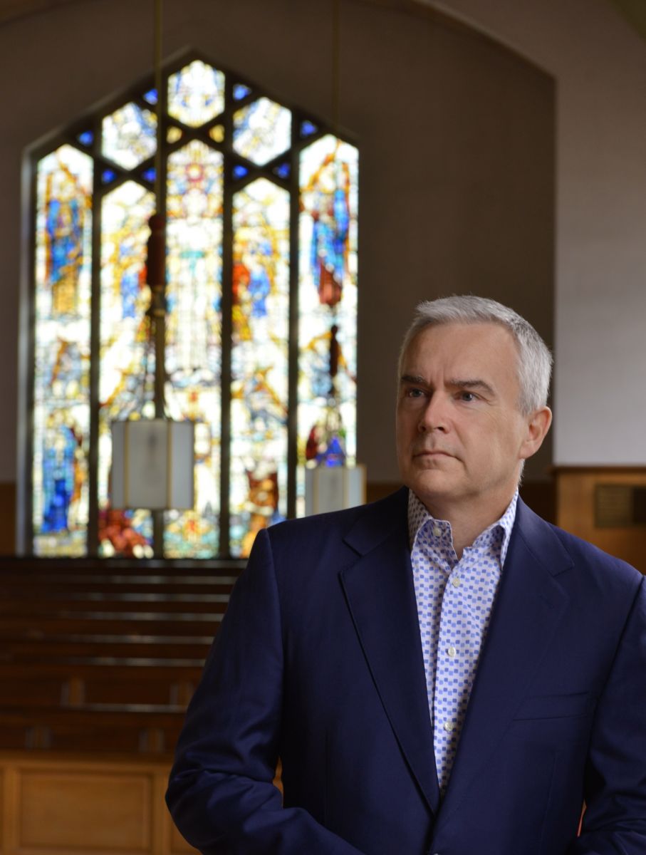 Broadcaster Huw Edwards inside a church