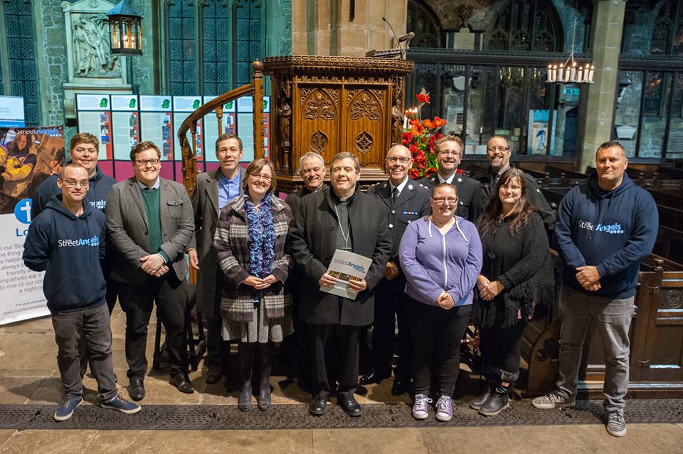 A group of the Street Angles with Bishop Tony, Paul Blakey, Steve Brock and representatives from Calderdale Police at the celebration evening