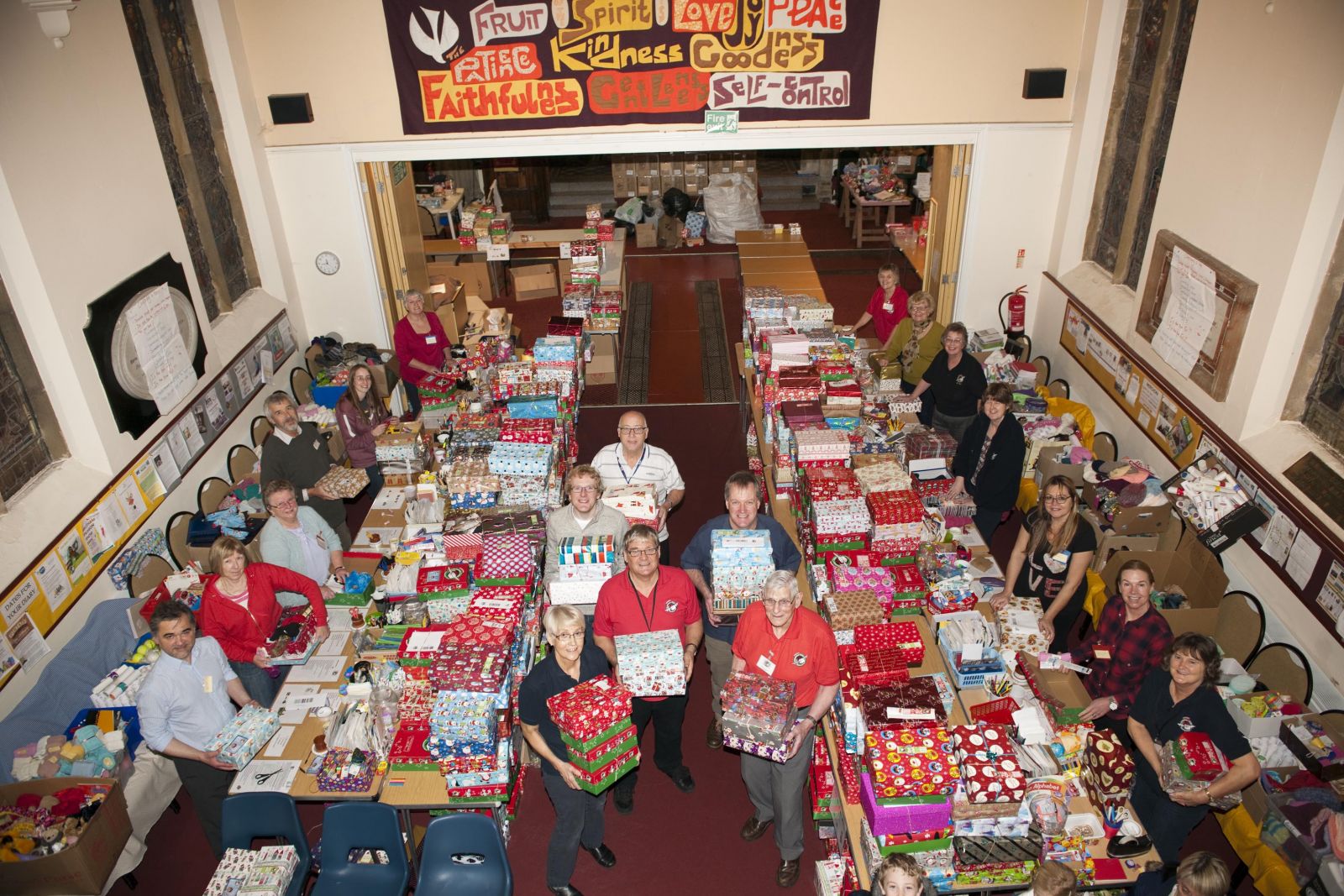 Operation Christmas Child volunteers with many of the shoebox gifts