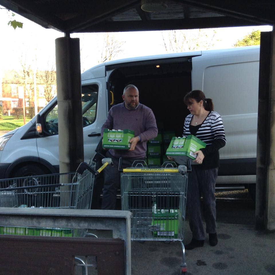 Moving the milk from the van into St Catherine's