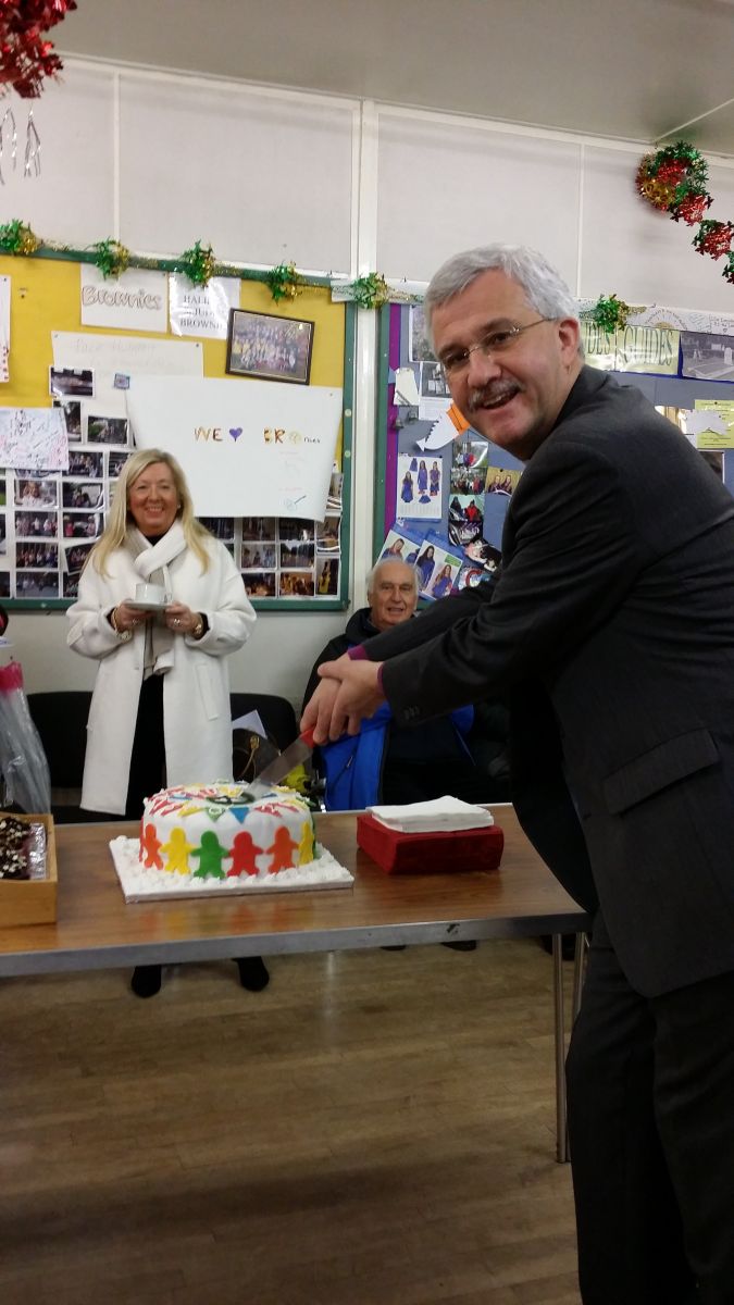 Bishop Jonathan cutting the cake