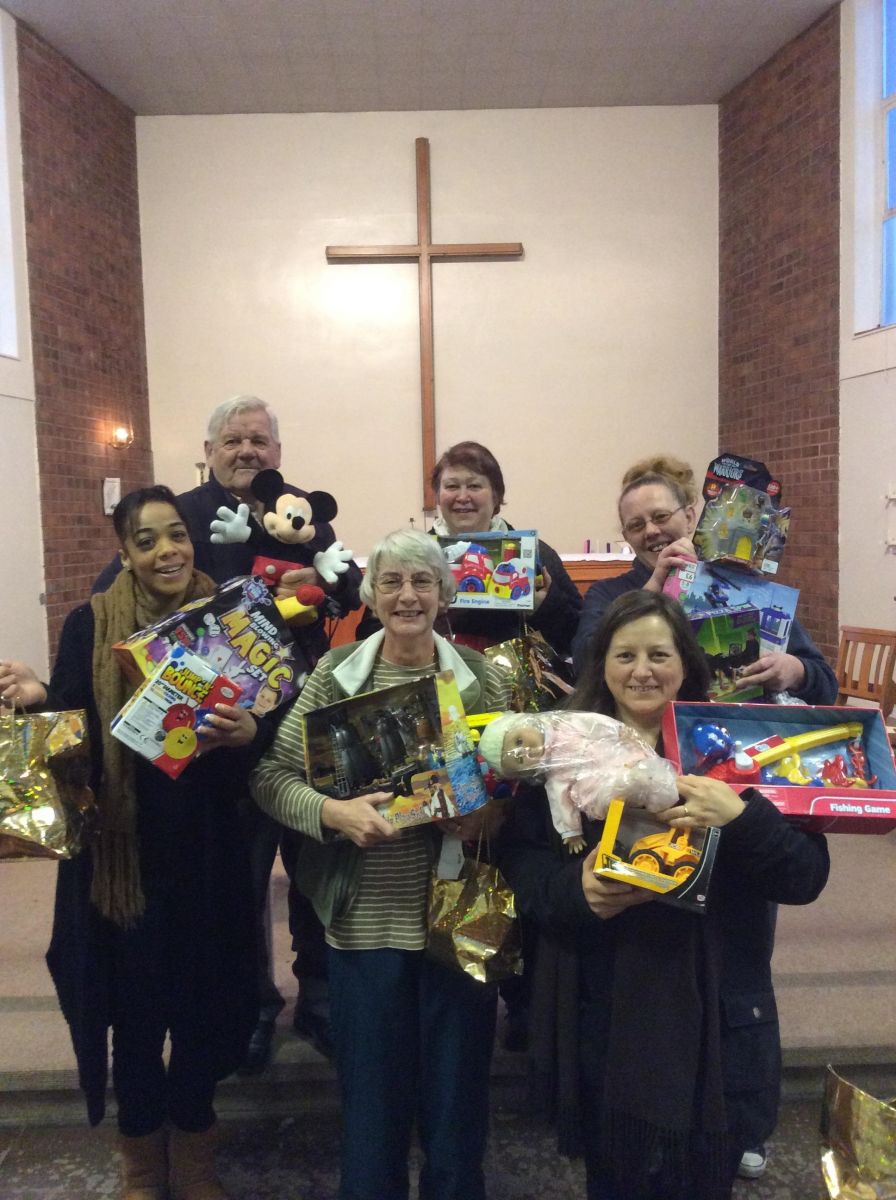 Volunteers with some toys to be distributed