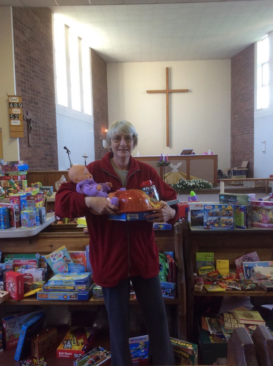 Martine Hinchcliffe with some toys to be distributed