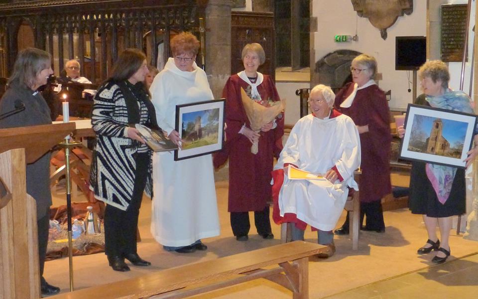 Peter being presented with the photographs